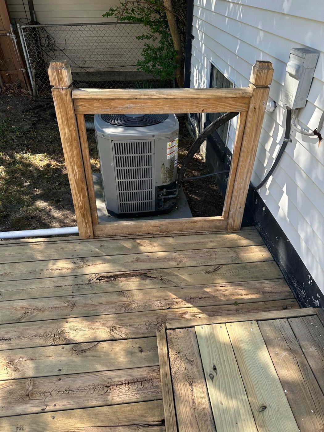 Deck railing frame with its lattice panel missing before repair