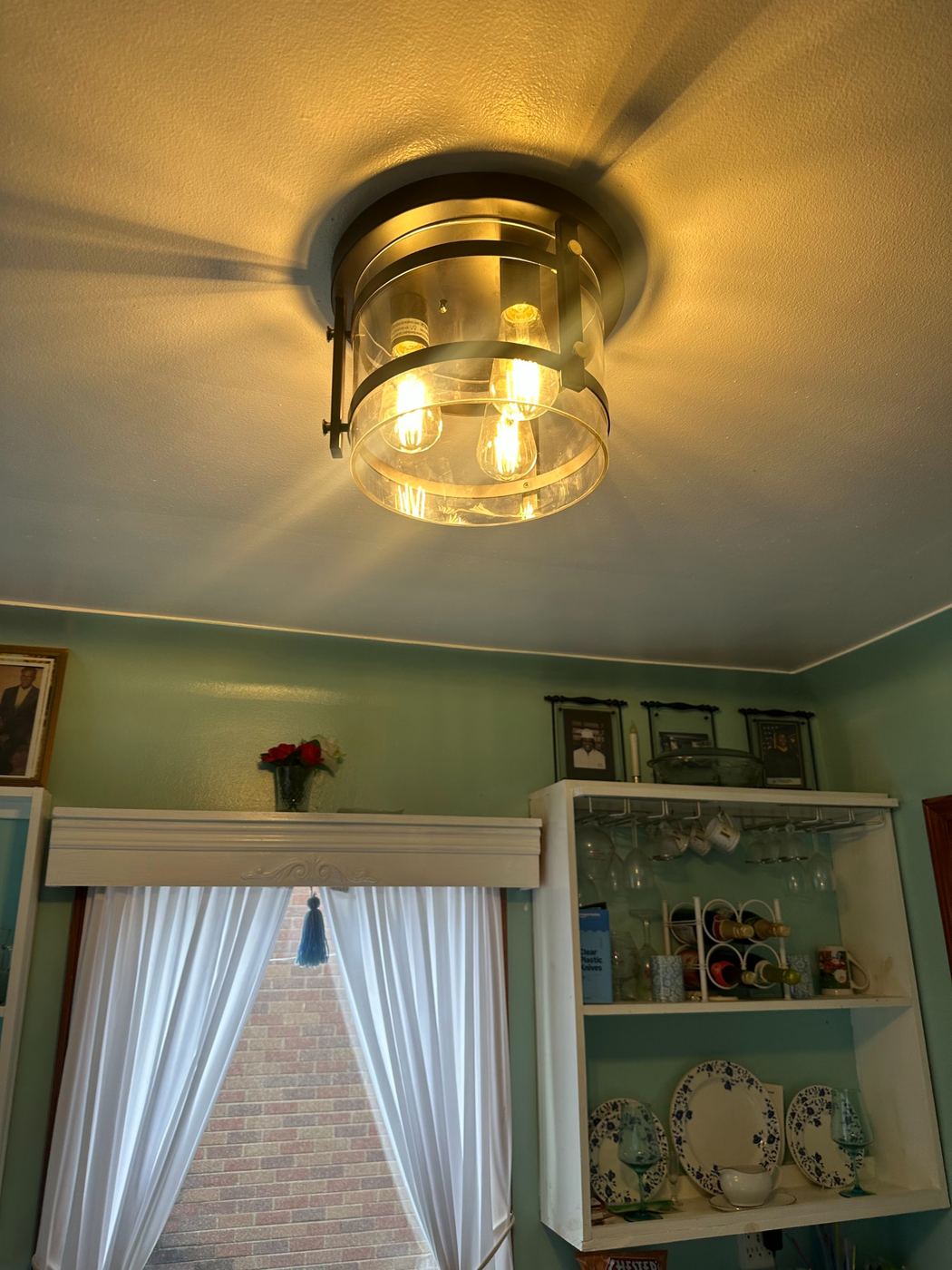 Modern drum light fixture with Edison bulbs installed by SLY Residential in its place